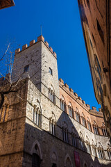 Fototapeta na wymiar Medieval tower in Siena historic center, Italy