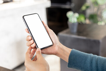 cell phone blank white screen mockup.hand holding texting using mobile on desk at office.background empty space for advertise.work people contact marketing business,technology