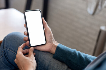 cell phone blank white screen mockup.hand holding texting using mobile on desk at office.background empty space for advertise.work people contact marketing business,technology