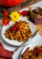 pumpkin waffles on a bright autumn table. autumn, halloween, holidays, holiday, halloween food,...