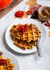 pumpkin waffles on a bright autumn table. autumn, halloween, holidays, holiday, halloween food, healthy food, organic food, farm products, autumn menu, concept.