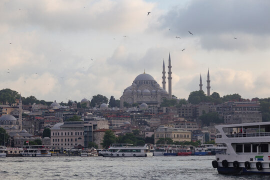 Istanbul / Turkey - 12 June 2022: Eminonu port with the Hagia Sophia museum in the background, Istanbul, Turkey