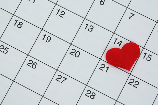 Red heart shape on the date of the 14th day in the calendar.