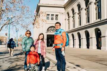 family walking in the city