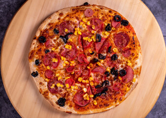 Pizza. Traditional Italian cuisine delicacies. mixed pizza on dark background