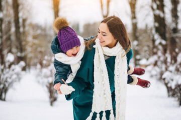 Mother and daughter in winter park