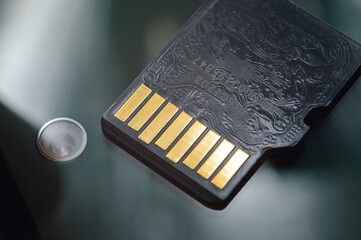 micro sd card lies on the smartphone screen. close-up