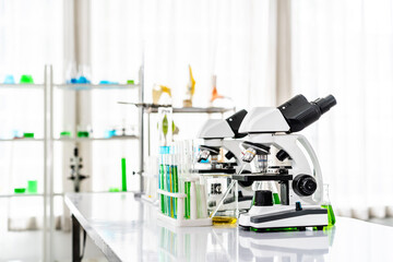 Colorful rows of laboratory or classroom test tubes and microscope with metal lens, Science and education. Scientific experiment, Researcher, Concept of medical or science laboratory,