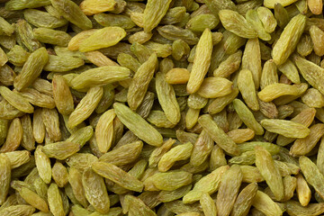 Sweet dried green Afghans raisins full frame close up as background