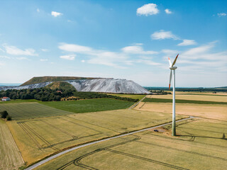 panorama of the countryside - potash landfill with wind energy plant