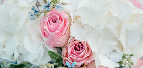 bouquet flowers background white hydrangea flowers and pink roses. texture, top view, close up. blooming flowers festive background, pastel and soft bouquet floral card