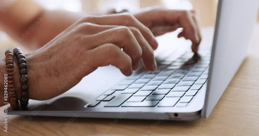 Aufkleber man with laptop writing email, social media or blog post. young guy typing, at table in modern house