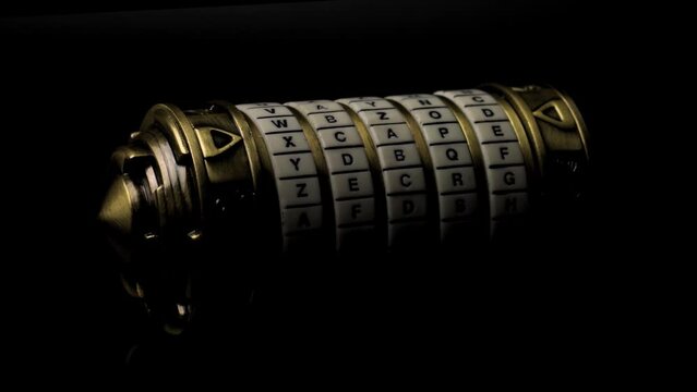 4k video of a metal cryptex secured by letter combination lock spinning on a dark background concept for difficult puzzle solving, hide important message and password protected secret documents
