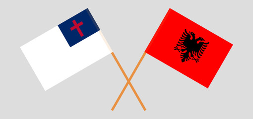 Crossed flags of christianity and Albania. Official colors. Correct proportion