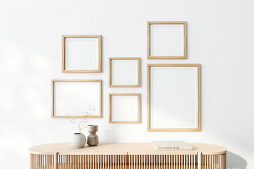 Naklejka premium Poster arts mockup with wooden frames on white wall. 3d rendering, illustration 