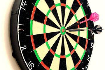 arrow darts in a center a target on white, darts board close up