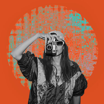 Stylish woman in jacket holding vintage camera isolated on orange background. Old fashioned style. The concept of surrealism, inspiration. Contemporary Arts. Modern art collage.