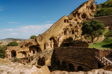 View of David Gareja Lavra orthodox monastery caves built in rock Georgia in semi-desert.  - 529466037