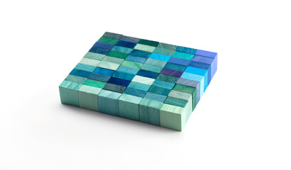 Slab of multi colored wooden blocks in blue tone isolated on white.  Background or cover for something creative or diverse.
