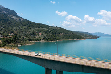 Fototapeta na wymiar Bridge Over A Lake In A Mountainous Landscape. Central Greece, Lake Kremasta