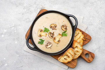 Mushroom soup with bread and fresh mushrooms, autumn seasonal cream soup with vegetables
