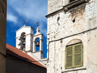 Fototapeta premium Bell tower with clock, Church of St. Barbara at Sibenik, Croatia