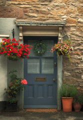 Naklejka na ściany i meble Door with flowers in an English house