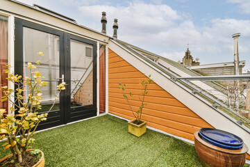Terrace of modern attic building with tiled roof