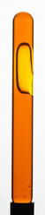 Yellow viscous liquid sunflower lecithin with bubbles in a transparent test tube on a white background