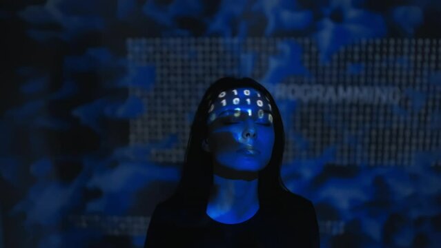 Portrait of young woman with glitched projection of zeros and ones on her face and background. Digital world, virtual reality, metaverse, information overdose, concept