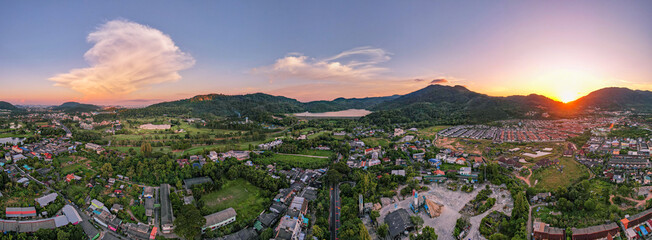 Panorama nature view Aerial view of Kathu district Phuket Thailand from Drone camera High angle view.Beautiful building in sunset or sunrise sky landscape, Mountains view