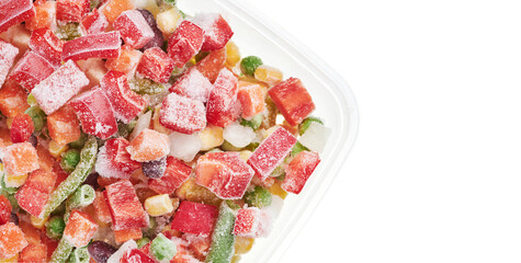 Closeup of frozen chopped vegetables in container. Stocks of food. Top view. Background. Text space.