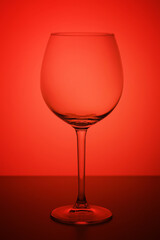 glass of wine on colorful background