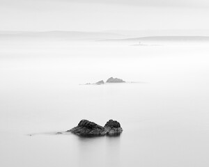 mist over the sea and rocks