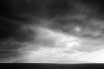 storm clouds over island