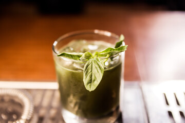 Green cocktail witn rum and mint, selective focus