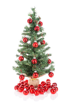Christmas tree decorated with red balls isolated at transparant  background