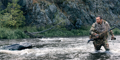 Lonely soldier crossing the river after the completion of the sabotage operation.