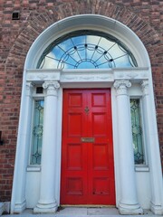 Red georgian door in Dublin, example of typical architecture of Dublin, Ireland