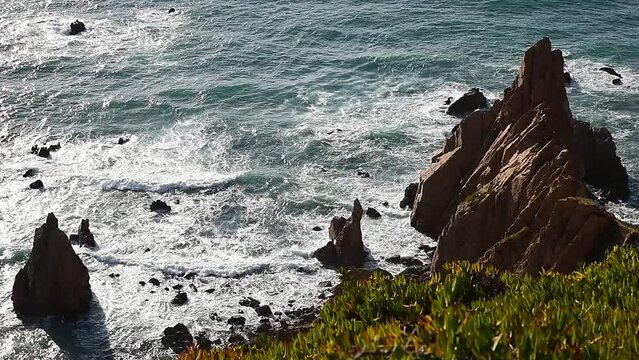 Scenic view of Aroeira beach and coastline rocks in Sintra-Cascais Natural Park in Portugal