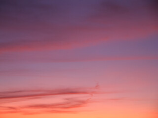 Full frame of the low angle view of clouds In sky during sunset with pink and fuchsia clouds.