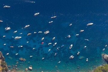 Fototapeta na wymiar Many boats on the blue sea closeup
