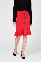 Fototapeta premium Red women's luxury Classic knee-length Skirt on model isolated on white background. Woman wearing Midi tight Skirt with volant, flounces, autumn spring outfit. Top view. Template, mock up
