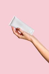 Woman hand showing cream product. Cosmetic product branding mockup. Daily skincare and body care...