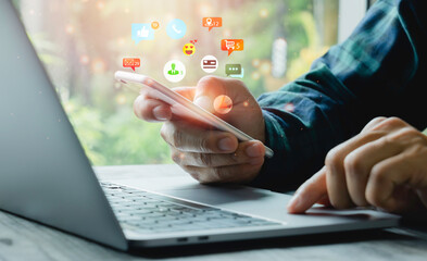 Social media interactions on mobile phones, a concept with notification icons of like, message, email, the comment above smartphone screen, person hands holding device, internet digital marketing