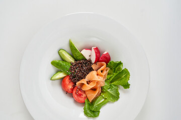 appetizer with red fish and vegetables