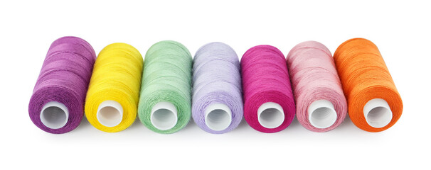 Set of different colorful sewing threads on white background