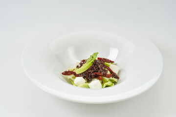 piece of fresh lettuce, sun-dried tomatoes, feto cheese
