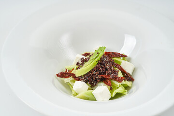 piece of fresh lettuce, sun-dried tomatoes, feto cheese