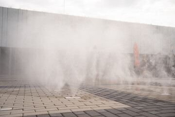 a water curtain that cools the air in public space on a hot summer day in Prague